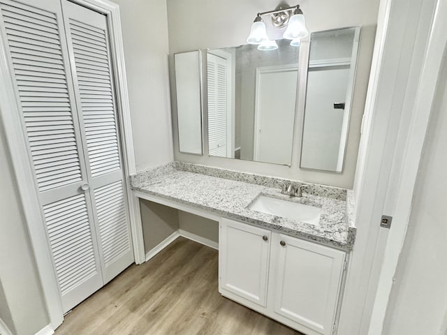 bathroom featuring hardwood / wood-style floors and vanity