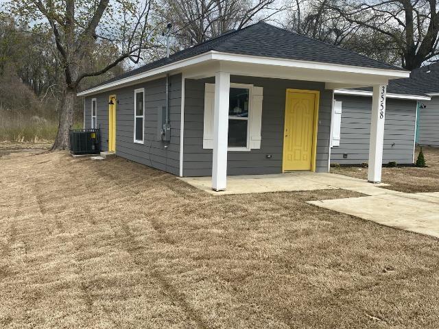 view of front of home featuring a porch and central AC