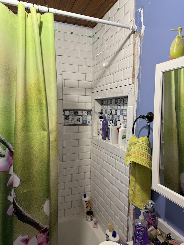 bathroom with shower / bath combination with curtain