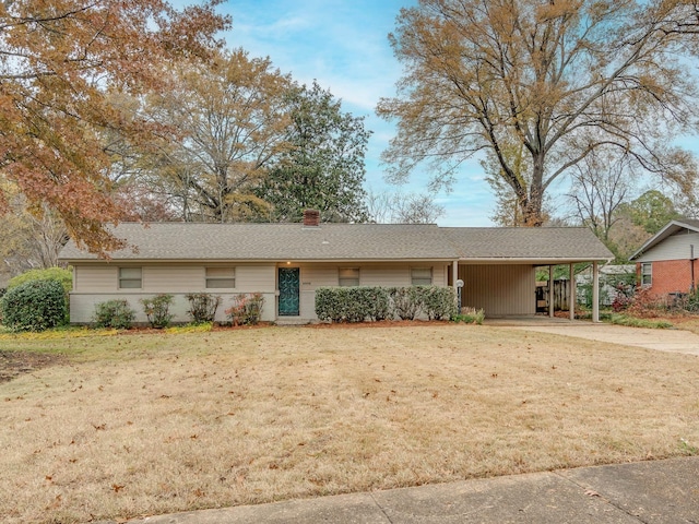 ranch-style house with a front yard and a carport