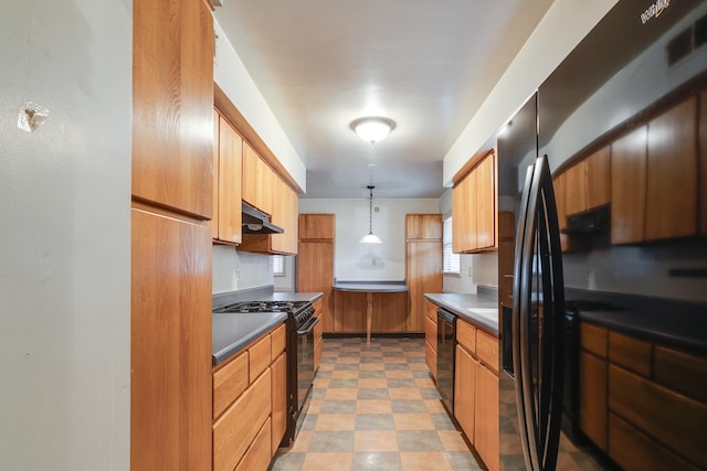 kitchen with black appliances and decorative light fixtures