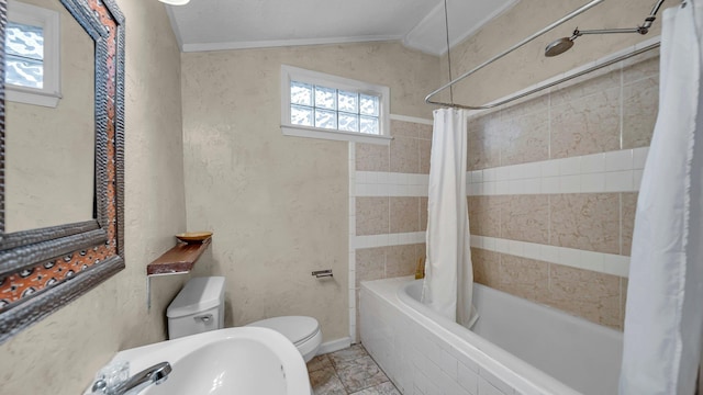 full bathroom featuring shower / bath combo, sink, vaulted ceiling, toilet, and ornamental molding