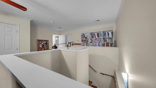 corridor featuring crown molding and sink