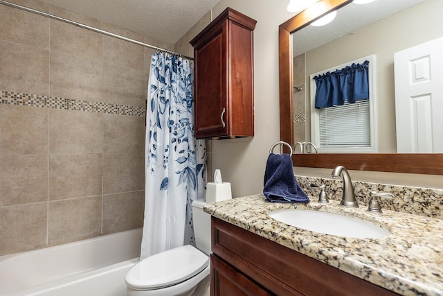 full bathroom with vanity, toilet, a textured ceiling, and shower / tub combo