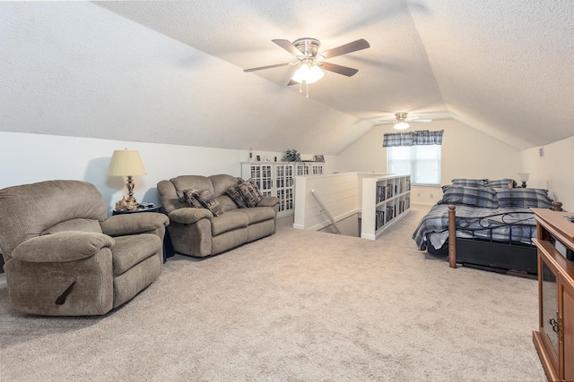 bedroom with ceiling fan, carpet floors, a textured ceiling, and lofted ceiling