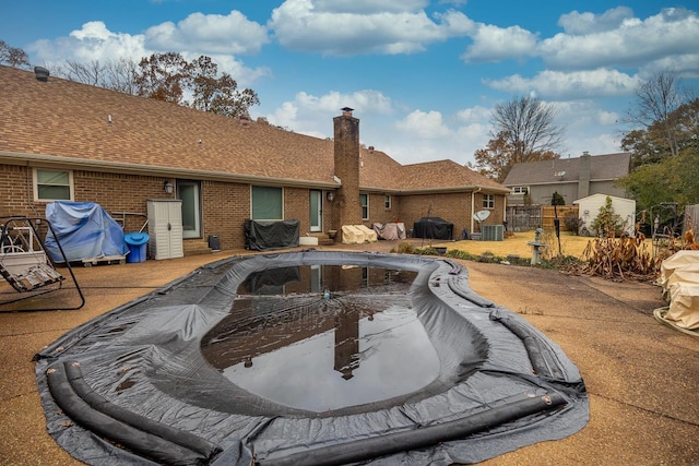 view of pool with central AC