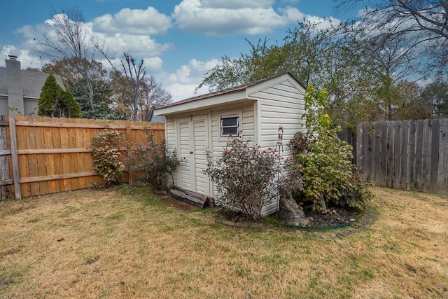 view of outbuilding featuring a yard