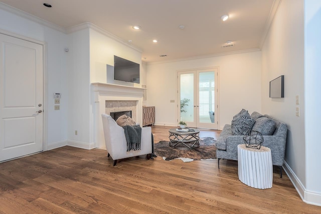 9207 Liggon Green Ln, Germantown, TN 38139 - living area with wood finished floors, ornamental molding, a fireplace, and recessed lighting