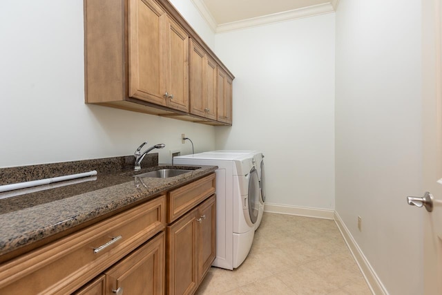 9207 Liggon Green Ln, Germantown, TN 38139 - laundry area featuring washing machine and clothes dryer, cabinet space, crown molding, and light tile patterned floors