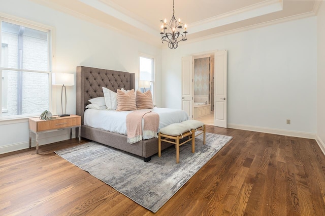 9207 Liggon Green Ln, Germantown, TN 38139 - bedroom featuring a raised ceiling, crown molding, a chandelier, wood finished floors, and ensuite bath