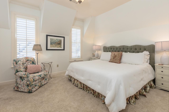 bedroom featuring light carpet