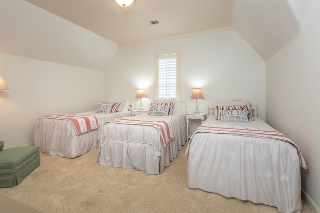 bedroom with carpet flooring and lofted ceiling