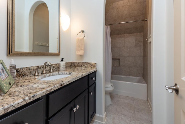 full bathroom featuring tile patterned flooring, shower / bath combo with shower curtain, vanity, and toilet