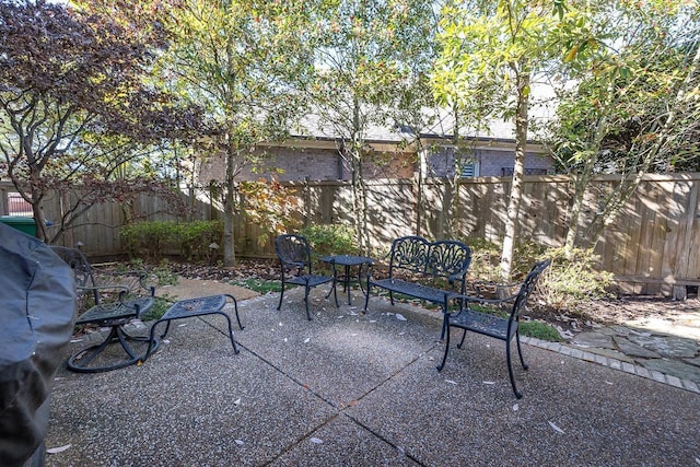 9207 Liggon Green Ln, Germantown, TN 38139 - fenced backyard featuring a patio area and a grill