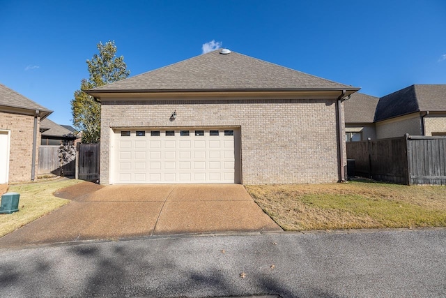 9207 Liggon Green Ln, Germantown, TN 38139 - view of property exterior featuring brick siding, concrete driveway, a shingled roof, and a garage