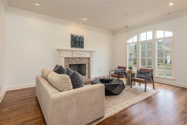9207 Liggon Green Ln, Germantown, TN 38139 - living room featuring ornamental molding, a premium fireplace, dark wood-style flooring, and recessed lighting