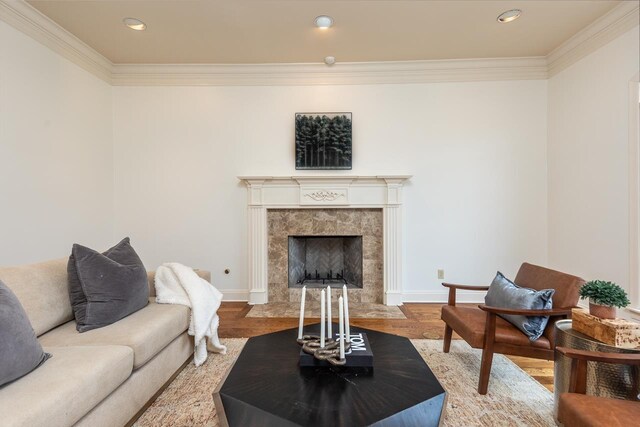 9207 Liggon Green Ln, Germantown, TN 38139 - living room featuring crown molding, wood finished floors, a fireplace, and recessed lighting