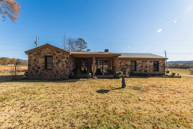 ranch-style home with a front lawn