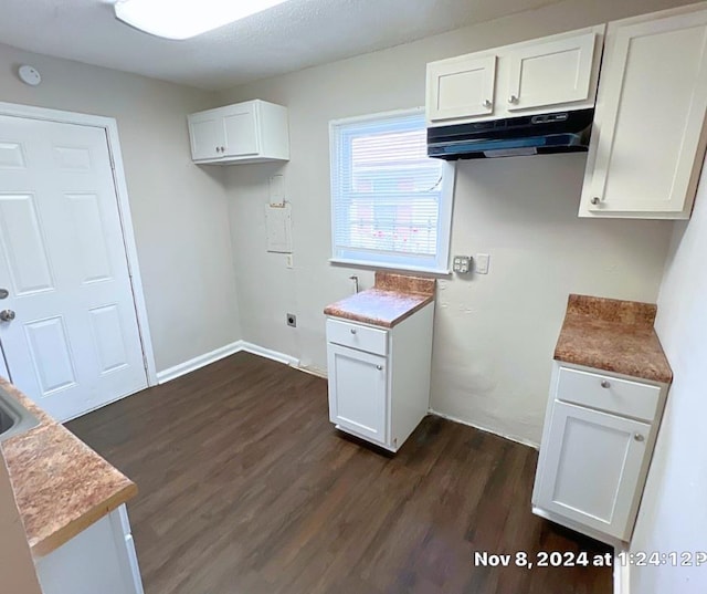 kitchen featuring white cabinets and dark hardwood / wood-style floors