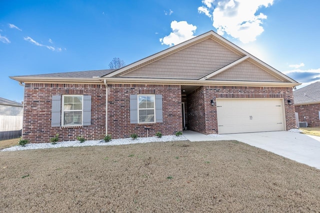 view of front of property with a front yard and a garage