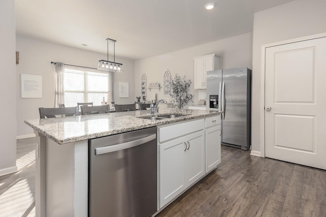 kitchen with sink, white cabinetry, a center island with sink, and stainless steel appliances