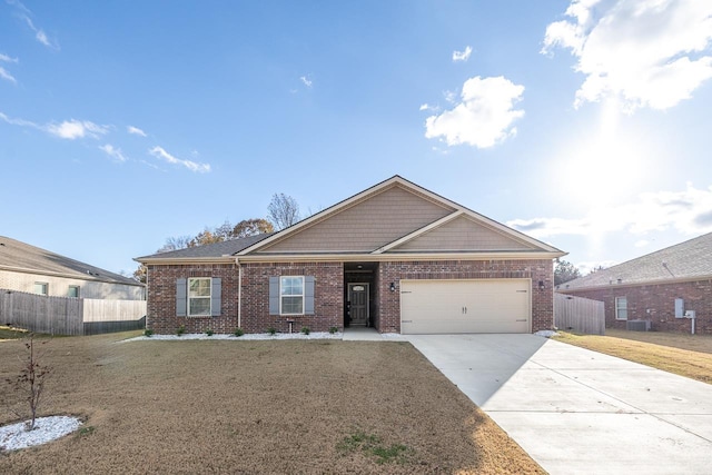 single story home with a front lawn and a garage