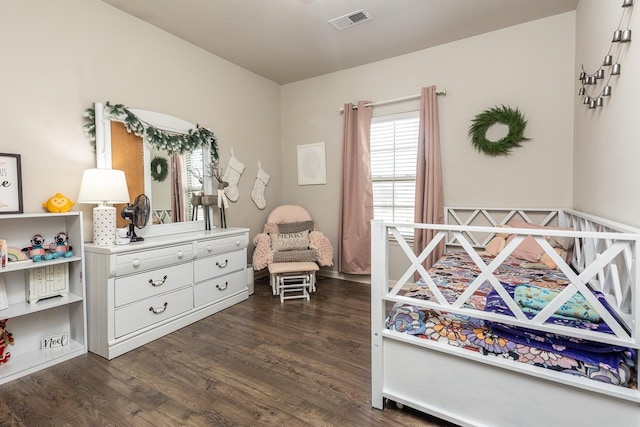 bedroom featuring dark hardwood / wood-style flooring