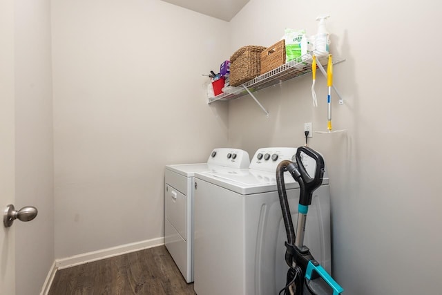 washroom featuring separate washer and dryer and dark hardwood / wood-style floors