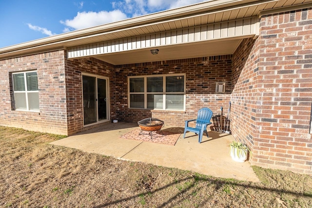 view of patio / terrace featuring an outdoor fire pit