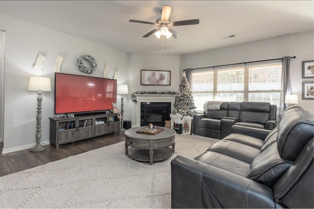 living room with ceiling fan and hardwood / wood-style flooring