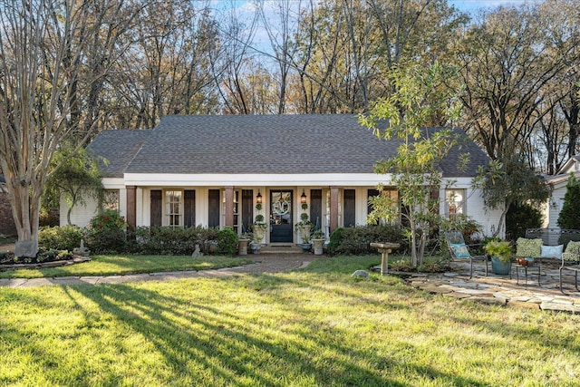 view of front of home with a front lawn and covered porch