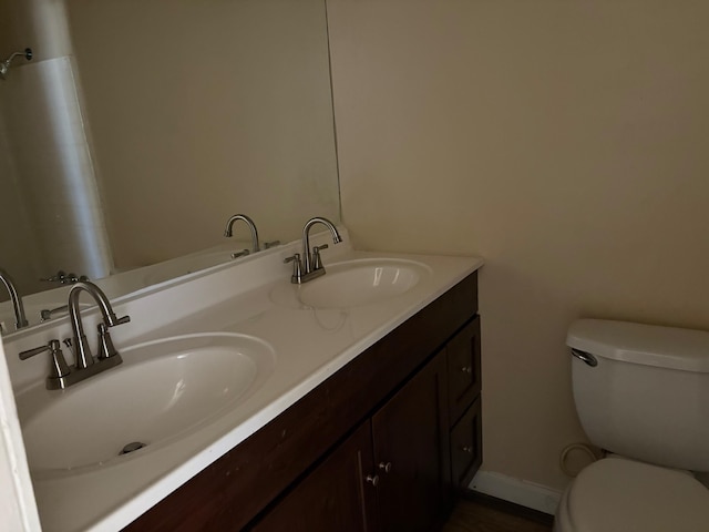 bathroom with vanity and toilet