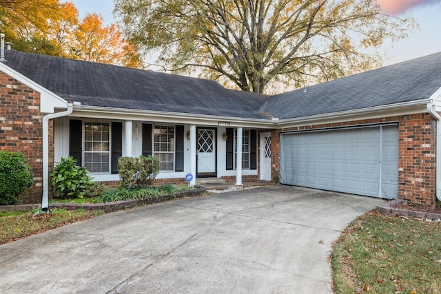 ranch-style house featuring a garage