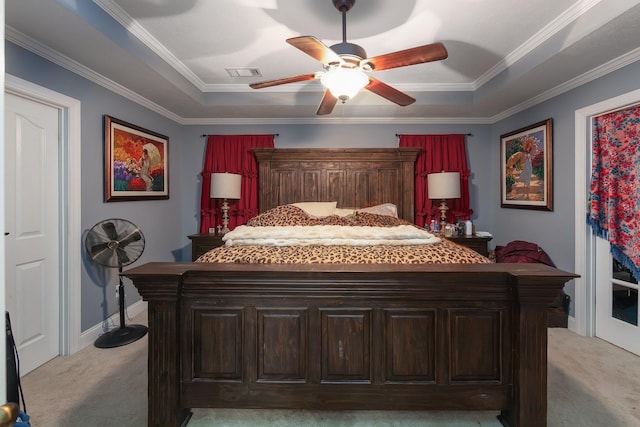 bedroom featuring a raised ceiling, ceiling fan, light colored carpet, and ornamental molding