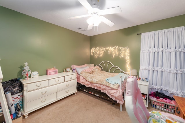 bedroom with ceiling fan and light colored carpet