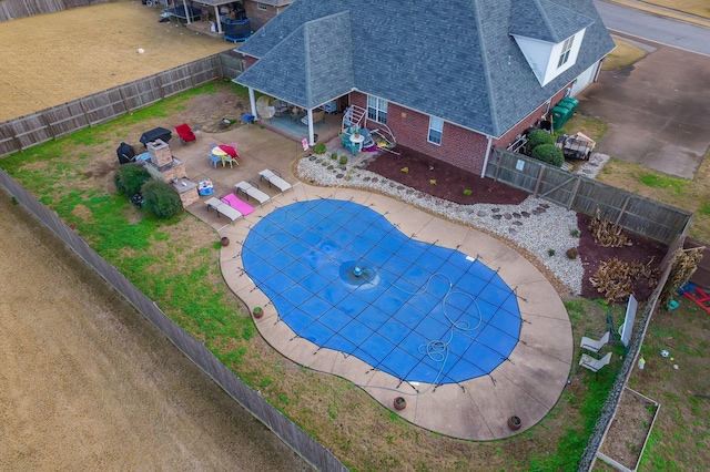 view of pool with an outdoor living space and a patio