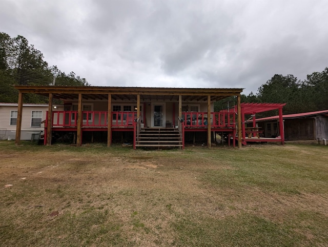 view of front of property featuring a front lawn and a wooden deck