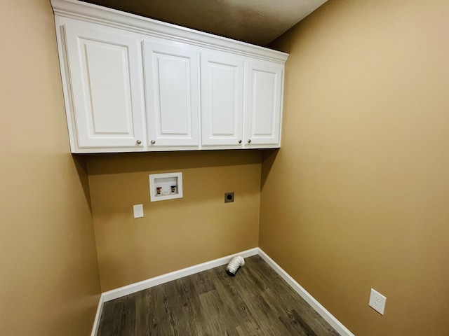 clothes washing area featuring washer hookup, electric dryer hookup, cabinets, and dark wood-type flooring