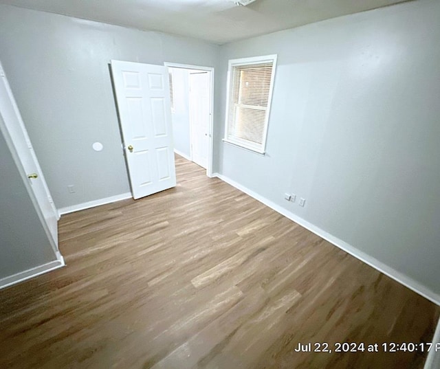 unfurnished room featuring wood-type flooring