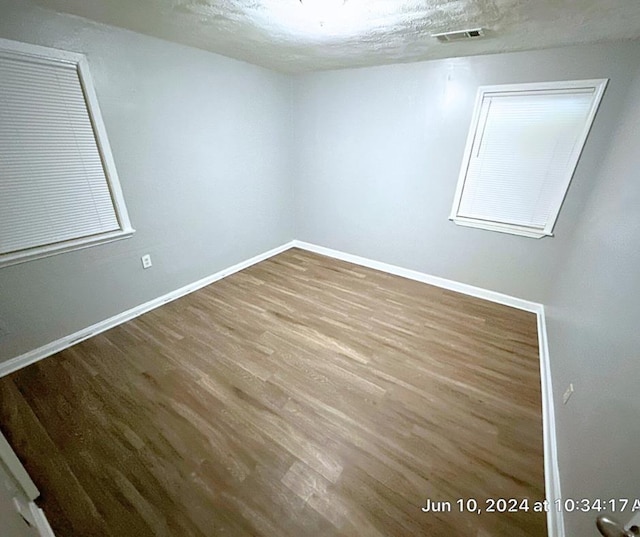 empty room featuring hardwood / wood-style flooring