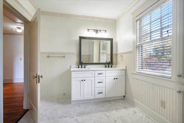 bathroom with crown molding, vanity, and hardwood / wood-style flooring