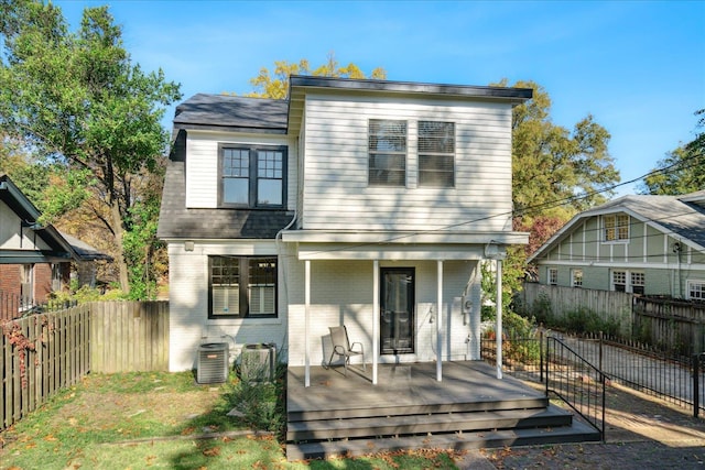 back of property featuring cooling unit and a deck