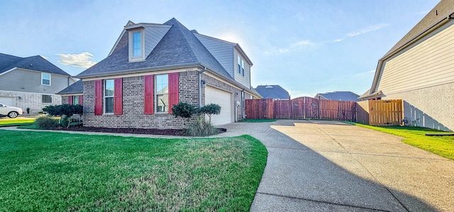 view of side of property featuring a garage and a yard