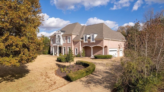 french country home with a garage