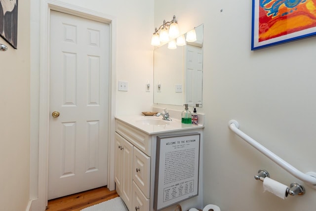 bathroom with hardwood / wood-style flooring and vanity