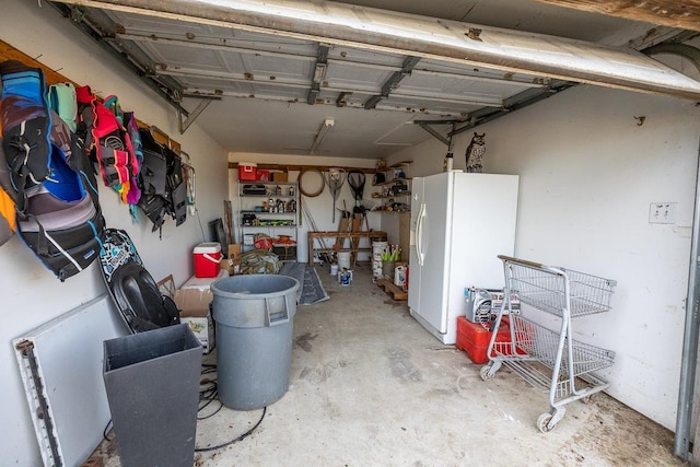 garage with white fridge with ice dispenser