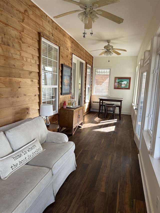 sunroom featuring ceiling fan