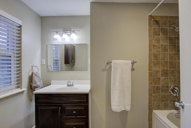 bathroom featuring vanity and tiled shower / bath combo