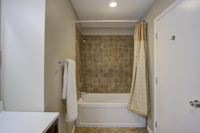 bathroom featuring tile patterned floors, shower / bath combination with curtain, and vanity