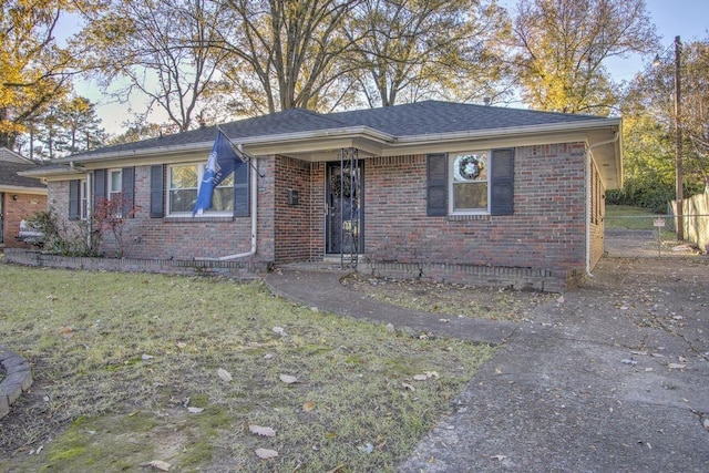 ranch-style house with a front yard